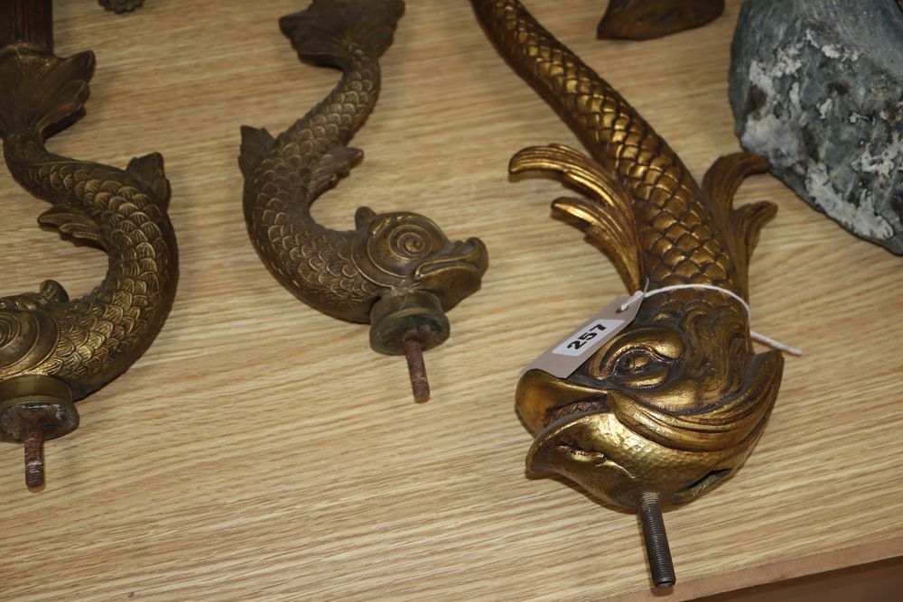 Two sets of four gilt metal dolphin supports, longest excluding screw thread 39cm